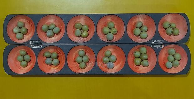 Oware With 50 Pebbles · Photo 1