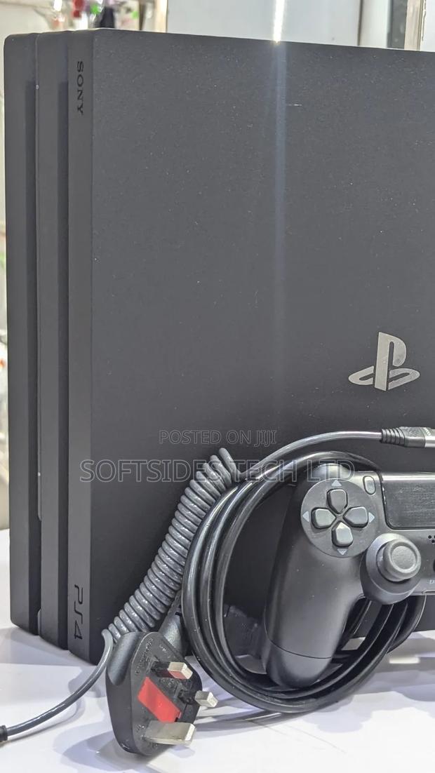 Very Neat Playstation 4 Pro With 15 Games and Accessories Shop Tested. · Photo 2