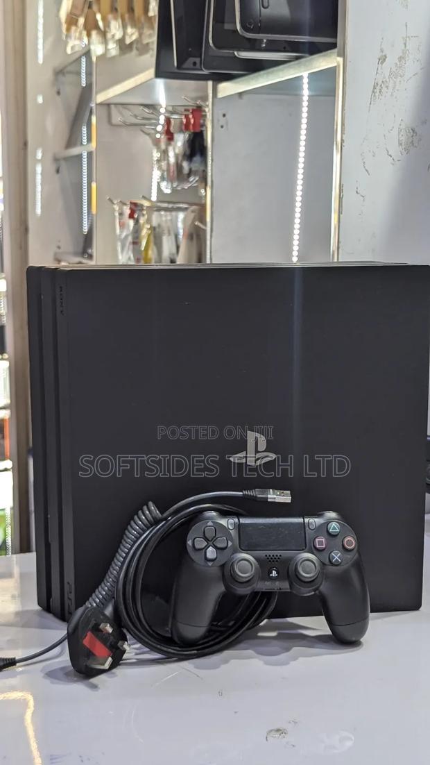 Very Neat Playstation 4 Pro With 15 Games and Accessories Shop Tested. · Photo 4