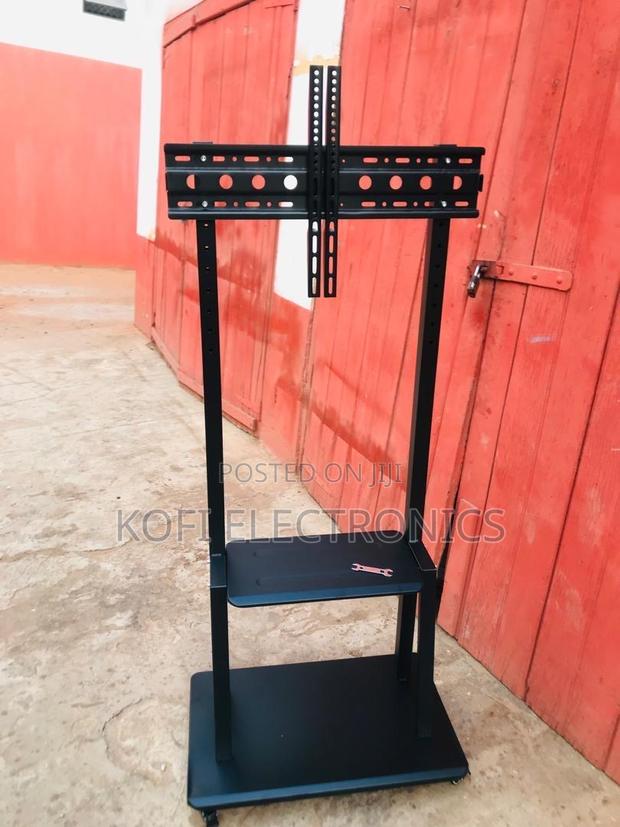 Professional Mobile Tv Mount With Dual Shelves and Wheels · Photo 1