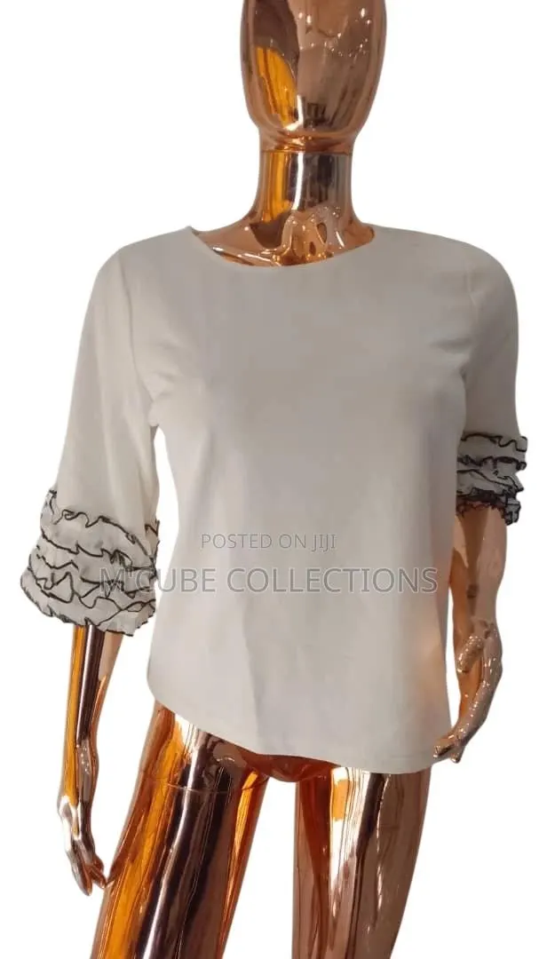 Cream Ruffle-Sleeve Blouse · Photo 1