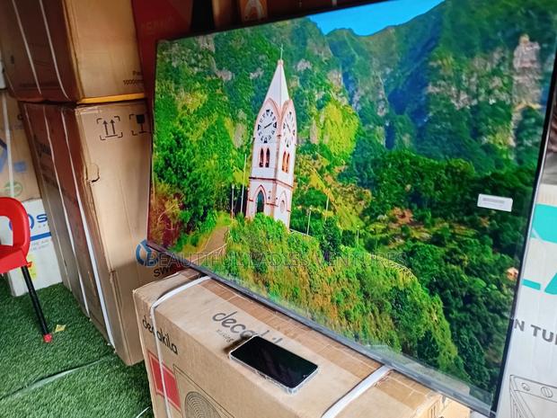 Attentive TCL 50inches Colossal Smart Tv Fat Cat TCL Tv · Photo 1