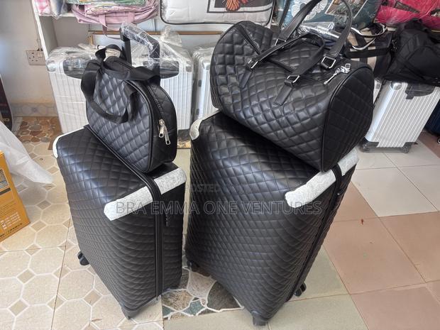 4-in-1 Quilted Leather Travel Luggage Set (Black) · Photo 1