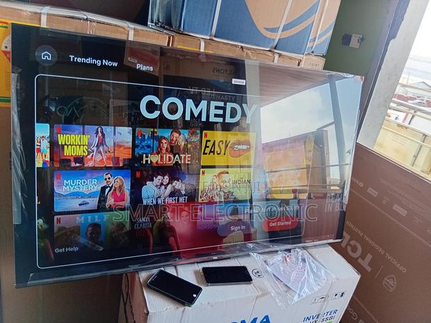 12. “Go Big With Tcl! 65-Inch Smart Tv on Sale Now!” · Photo 2