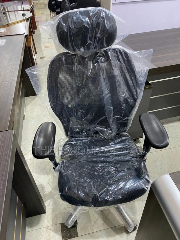 An Authentic Swivel Chair With Head · Photo 1