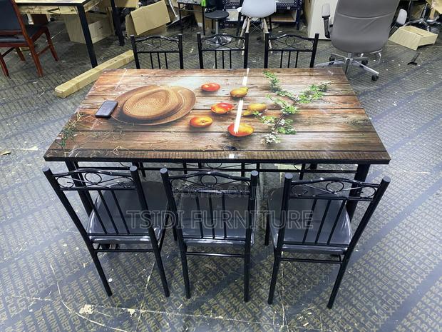 Glass Dining Table With 6 Chairs · Photo 1