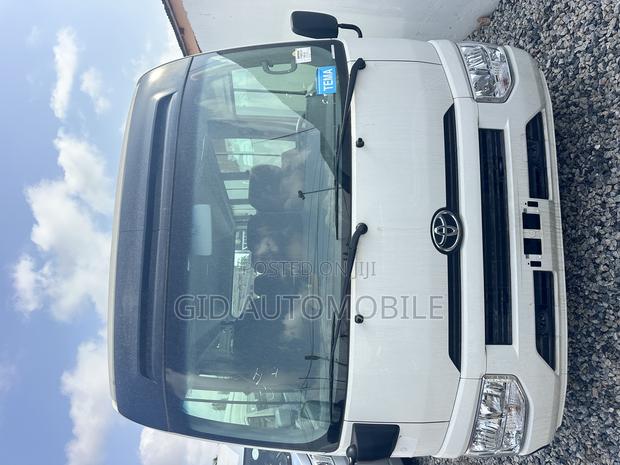 New Toyota Coaster 2025 Grey · Photo 1