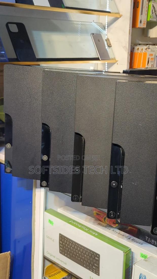 Black Playstation 3 Slim Cute Version With Games and a Controller · Photo 3