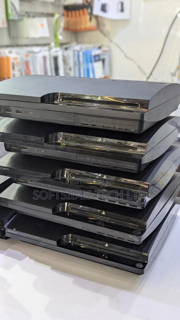 Black Playstation 3 Slim Cute Version With Games and a Controller · Photo 2