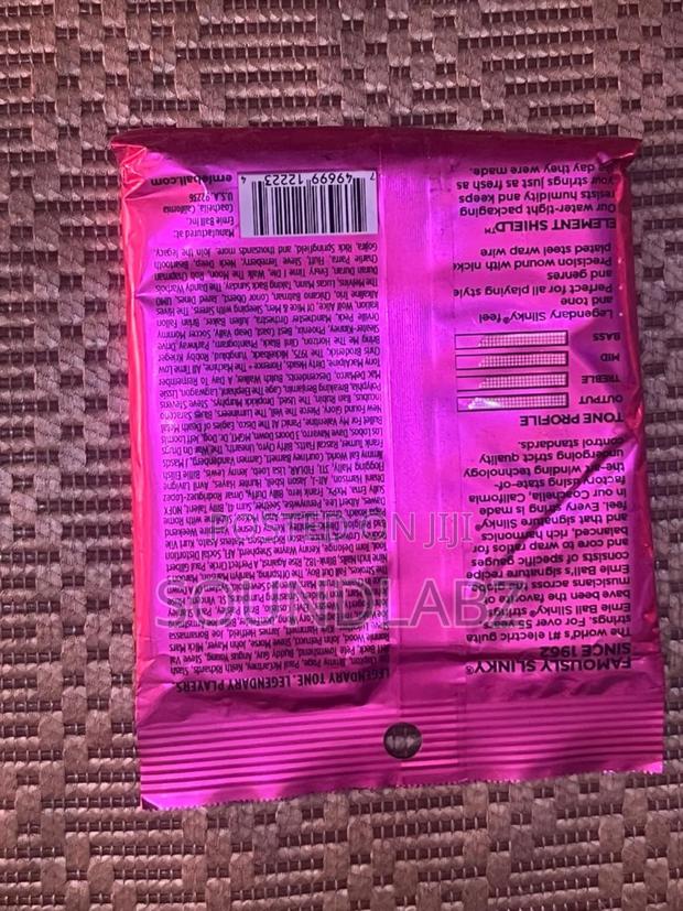 Ernie Ball Super Slinky Custom Gauge Electric Guitar Strings. · Photo 2