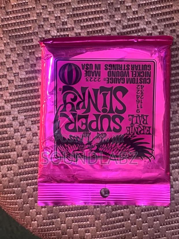 Ernie Ball Super Slinky Custom Gauge Electric Guitar Strings. · Photo 1