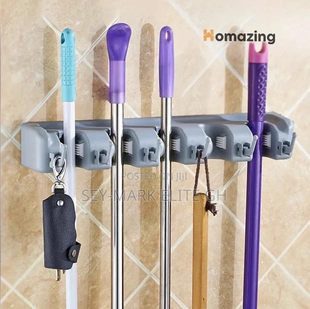 Broom Mop Sticks Holder · Photo 1