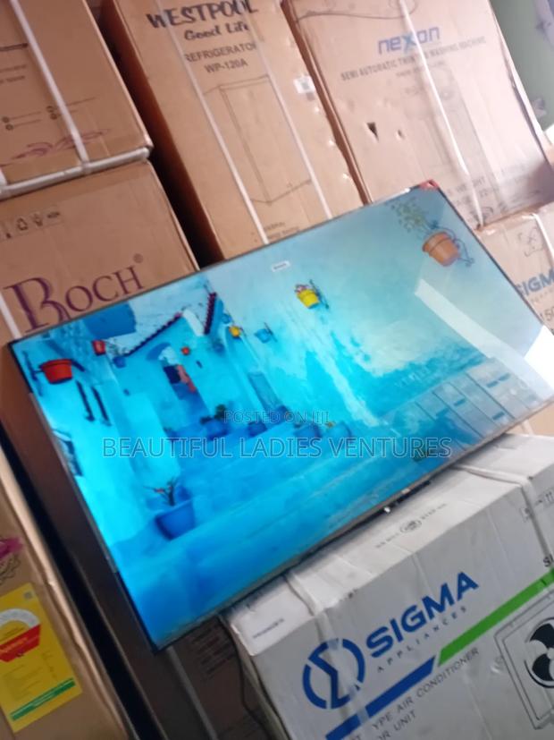 Bring Entertainment to Life With This 65-Inch Smart Led Tv Featuring · Photo 1