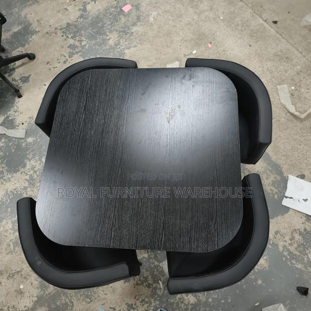 Black Wooden Table With 4 Comfortable Seats Dining Set · Photo 1