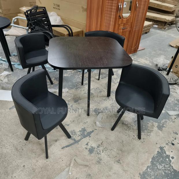 Black Wooden Table With 4 Comfortable Seats Dining Set · Photo 2