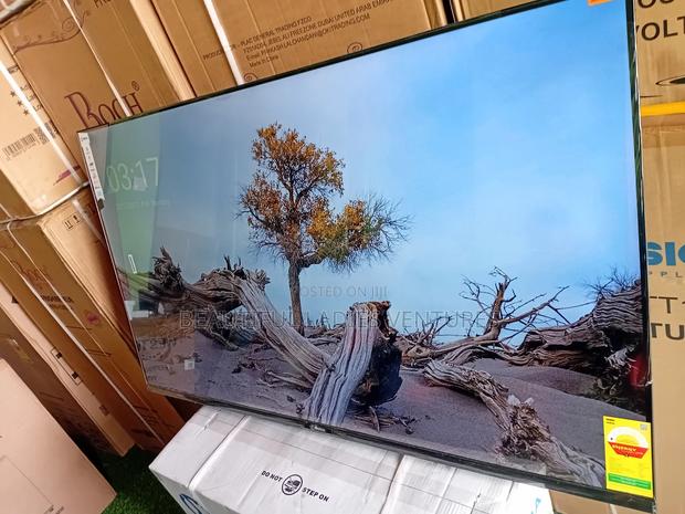 Sleek and Slim 55-Inch Smart Tv for Stylish Modern Living Spaces · Photo 1