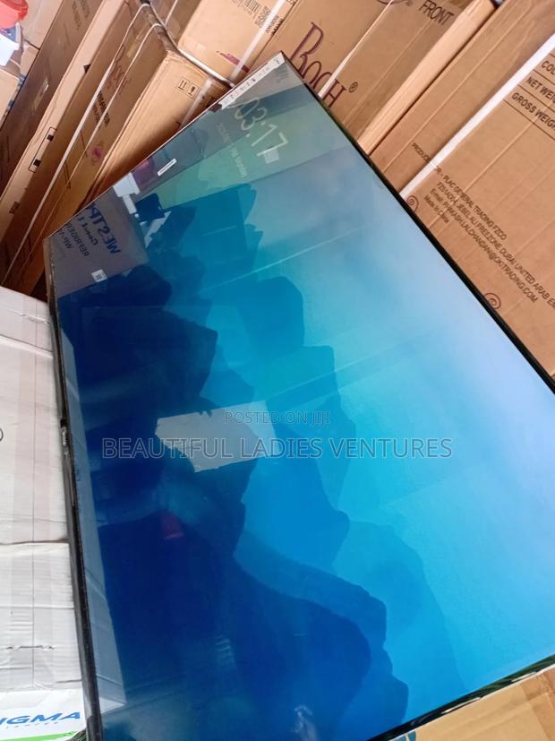 Sleek and Slim 55-Inch Smart Tv for Stylish Modern Living Spaces · Photo 2