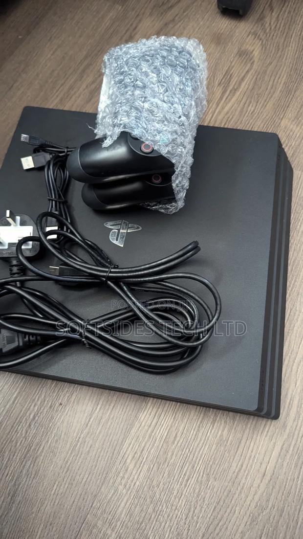Playstation 4 Pro With Two(2) Controllers And 17 Games Promo!! · Photo 1