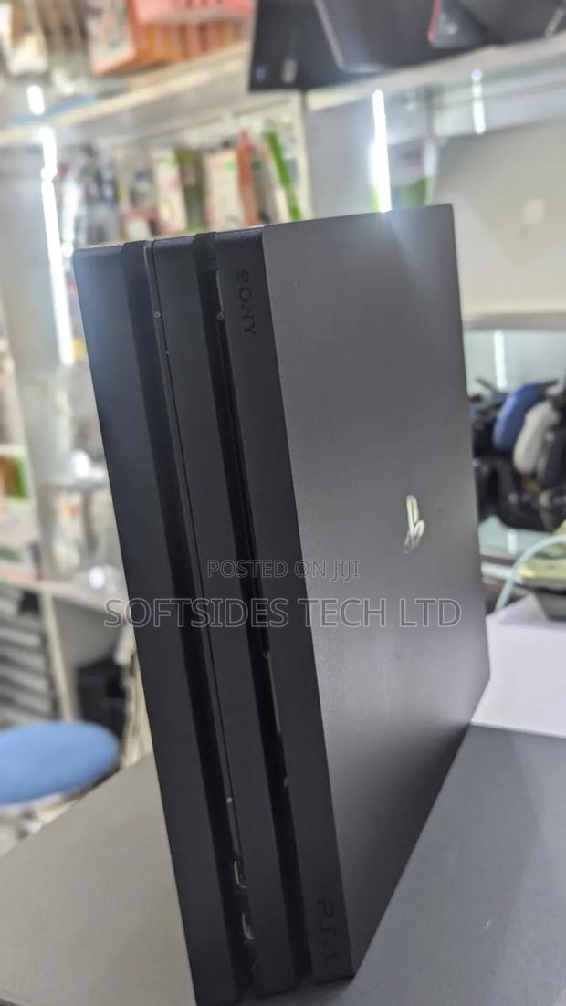 Playstation 4 Pro With Two(2) Controllers And 17 Games Promo!! · Photo 5