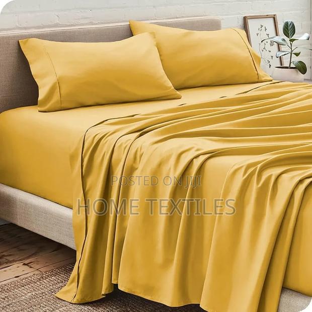 1 Fitted and 1 Flat Yellow Bedsheets With 4 Pillowcases · Photo 1
