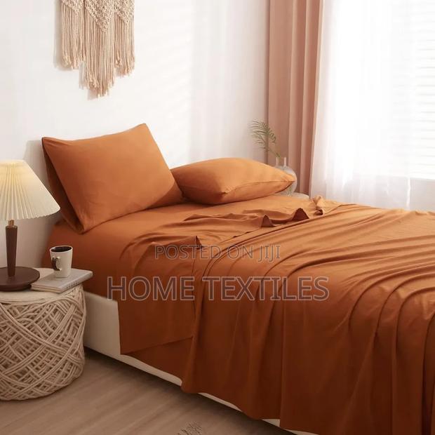 2 Brown Bedsheets and 4 Pillowcases · Photo 1