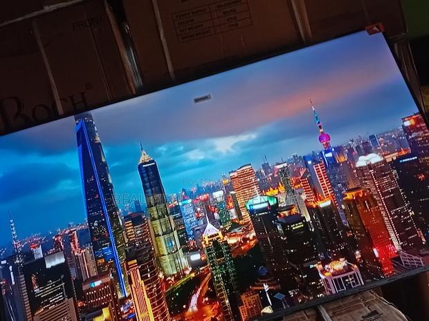 55-Inch Smart Tv Offering High-Definition Visuals and Wi-Fi Access · Photo 1