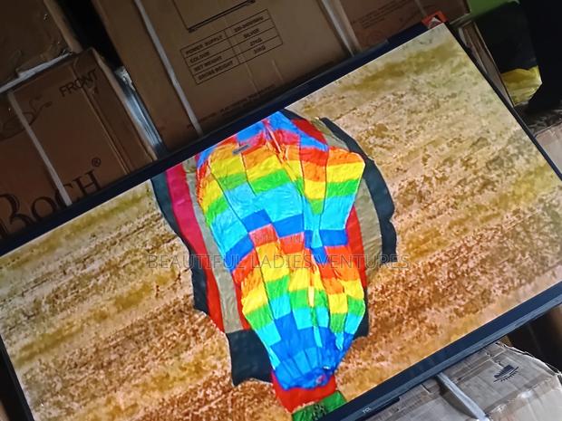 55-Inch Smart Tv Offering High-Definition Visuals and Wi-Fi Access · Photo 2