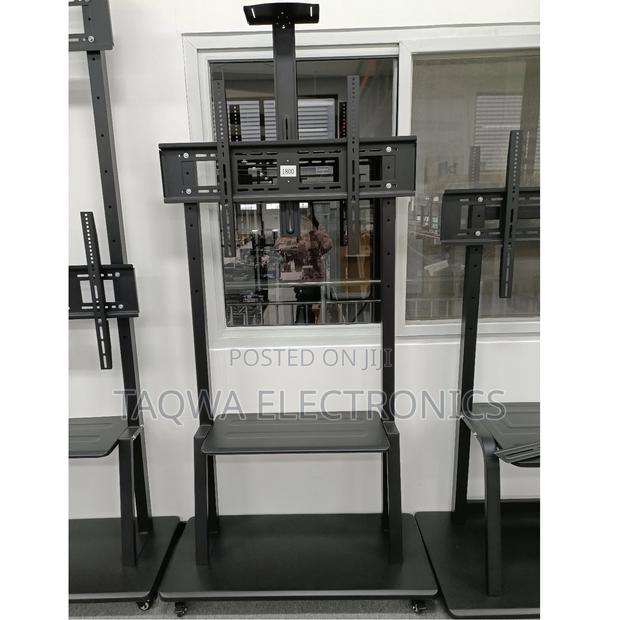 More- Thicker—32-75 “ Universal Mobile Tv Stand · Photo 1