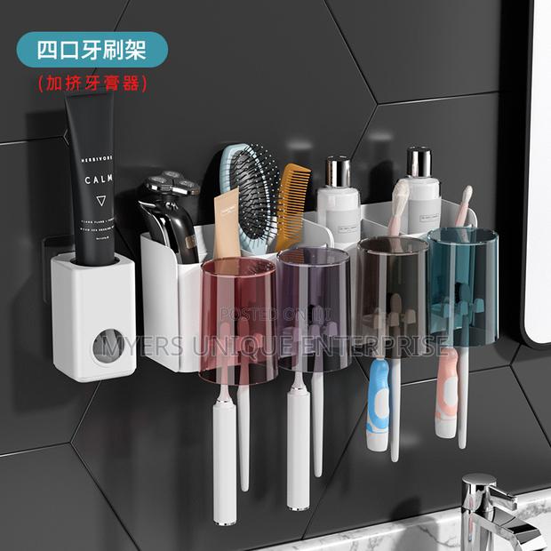 Stylish Wall Mounted Toothpaste Dispenser/Organizer · Photo 1
