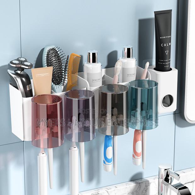 Classy Toothpaste Dispenser /Toothbrush Holder With Cups Organizer · Photo 1