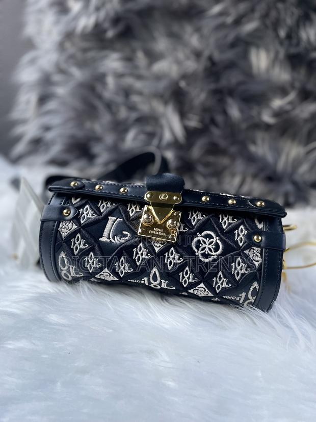 Cylindrical-Shaped Shoulder or Crossbody Bag · Photo 1