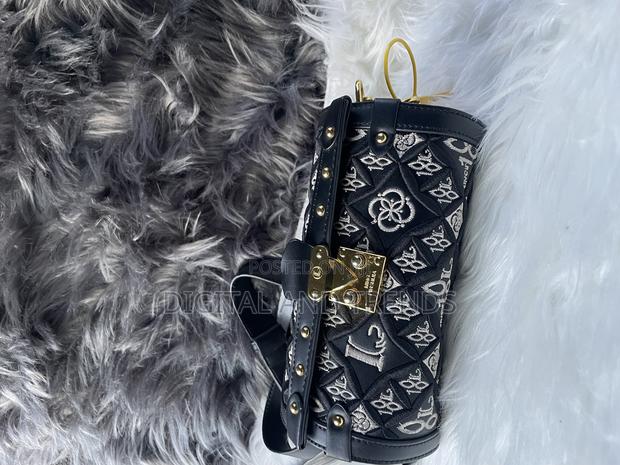 Cylindrical-Shaped Shoulder or Crossbody Bag · Photo 2