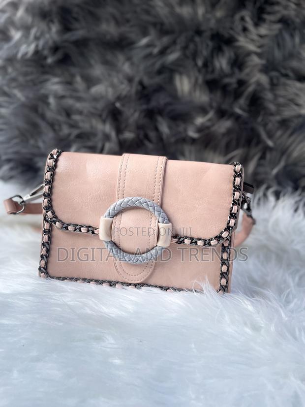 Pink Faux Leather Crossbody Bag · Photo 1