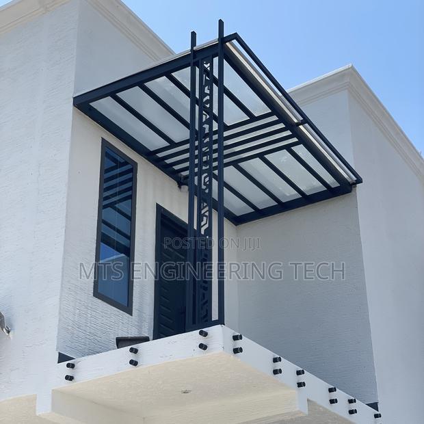 Modern Metal Shades With Polycarbonate Roofing · Photo 4