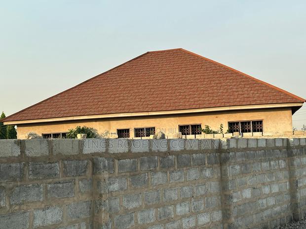 Aesthetically Pleasing Brown Shingle Roofing · Photo 1