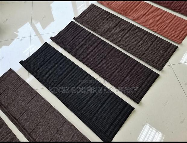 Brown, Orange, Black and Red Classic Euro Roofing · Photo 1