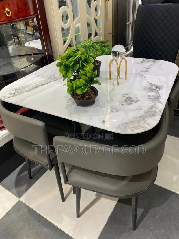 A Colorful Four Seater Marble Dining Set · Photo 1