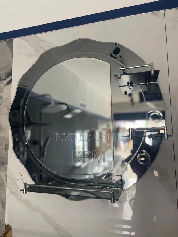 Round Bathroom Mirror With Triple Glass Shelves Attached · Photo 2