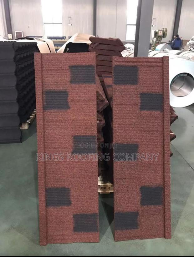 Specially Branded Brown-Black Shingle Roofing · Photo 1