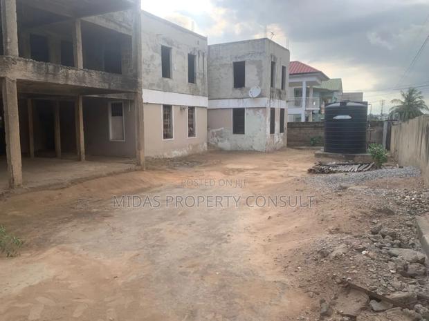 140x100ft Land With Structure For Sale At West Legon · Photo 1