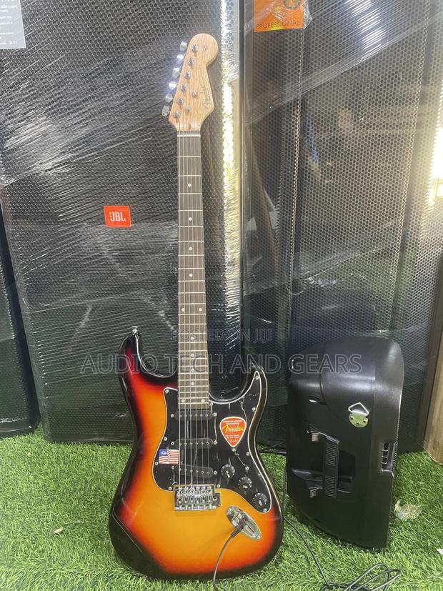 Fender Lead Guitar {Brown} · Photo 1