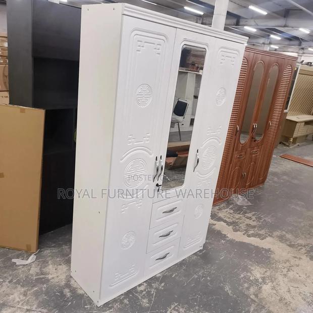Modern White Three-Door Wardrobe · Photo 1