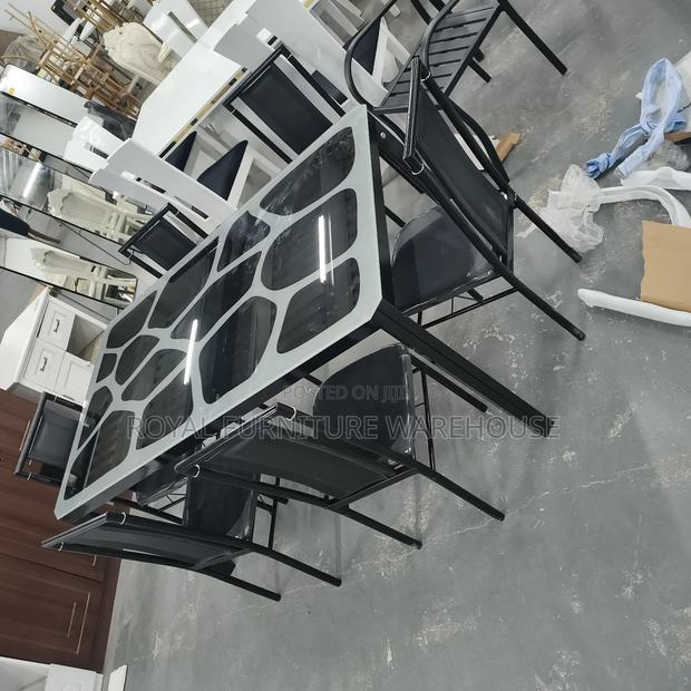 Modern Metal and Glass Dining Table Set With Six Black Chairs · Photo 2