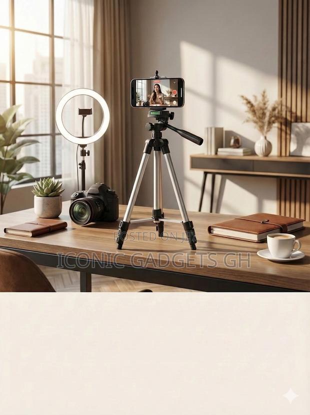 3110 Tripod Stand (3.5ft) Complete With a Phone Mount. · Photo 1