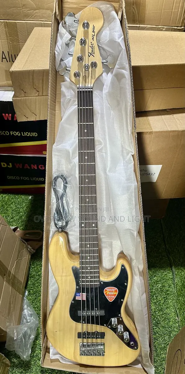 Fender 5-String Electric Bass Guitar With a Natural Wood Finish · Photo 1