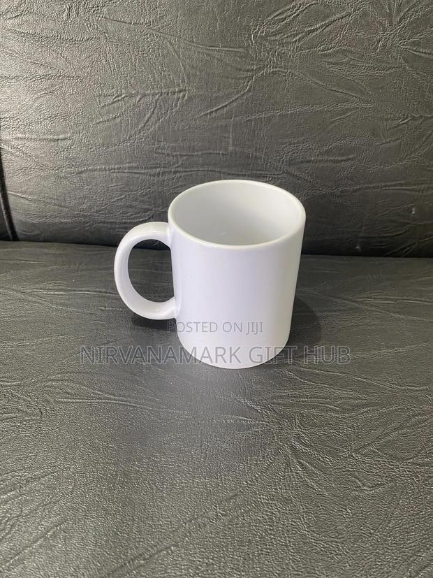 White and Magic Ceramic Mugs · Photo 2