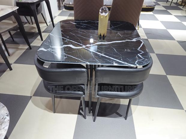 Marble Table and Four Set Dining Chairs · Photo 1