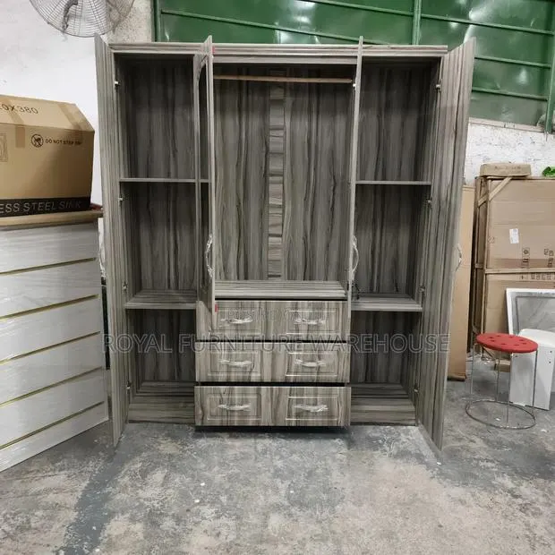 Four-Door Wooden Wardrobe With a Gray Wood Grain Finish. · Photo 1