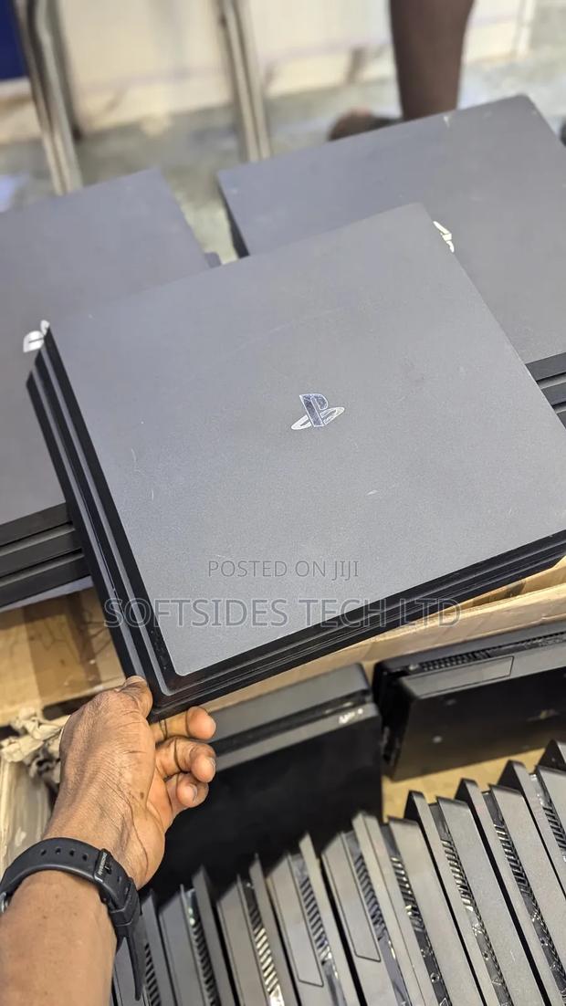 Clean Playstation 4 Pro Available With 17 Games And 2 Free Controllers · Photo 1