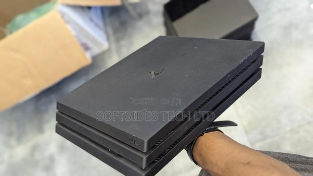 Clean Playstation 4 Pro Available With 17 Games And 2 Free Controllers · Photo 2